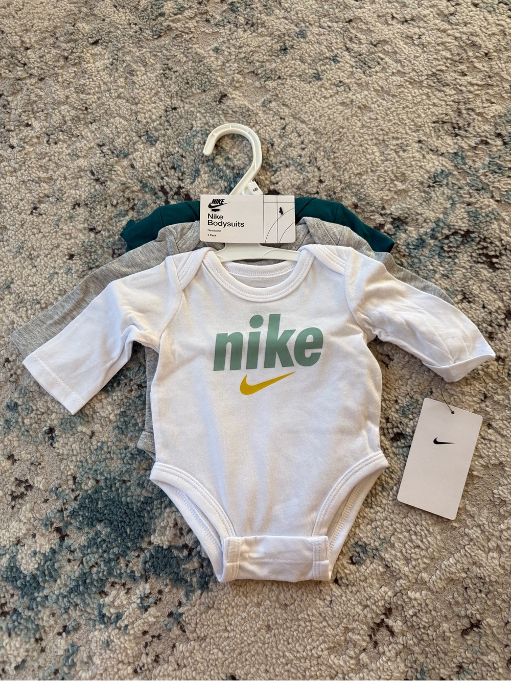 Nike White Baby Bodysuit with Green Logo and Yellow Swoosh